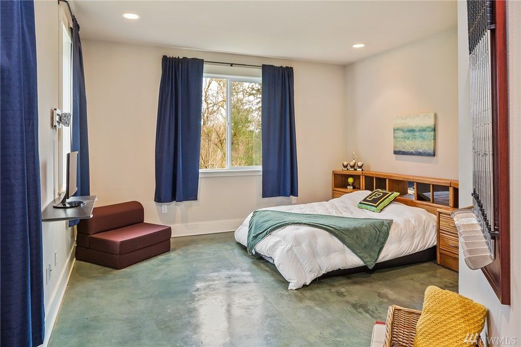 freshly painted bedroom with blue curtains and concrete floor in Cranberry Township, PA