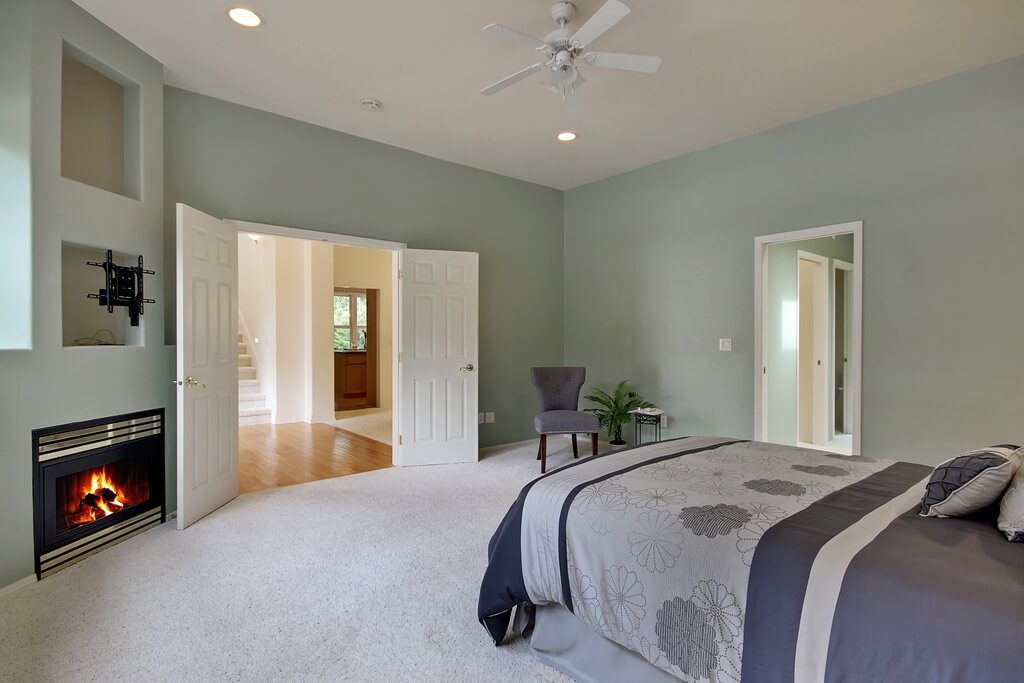 freshly painted master bedroom with sage green walls and ceiling fan in Cranberry Township, PA