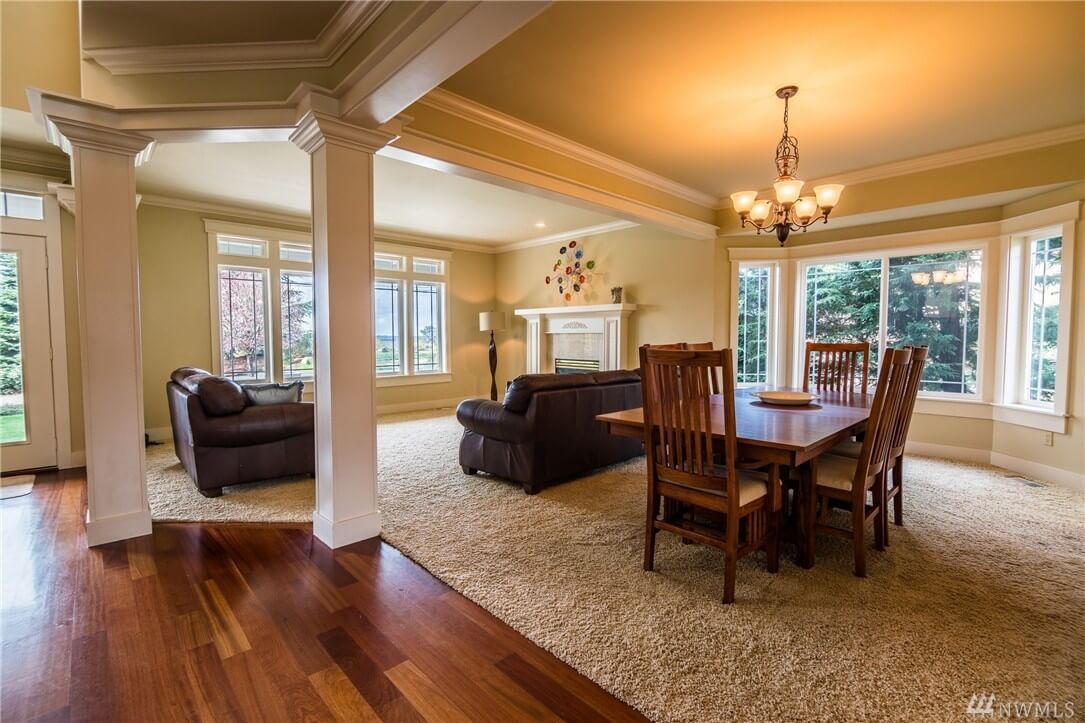 freshly painted open dining and living room with white columns and hardwood floors in Cranberry Township, PA