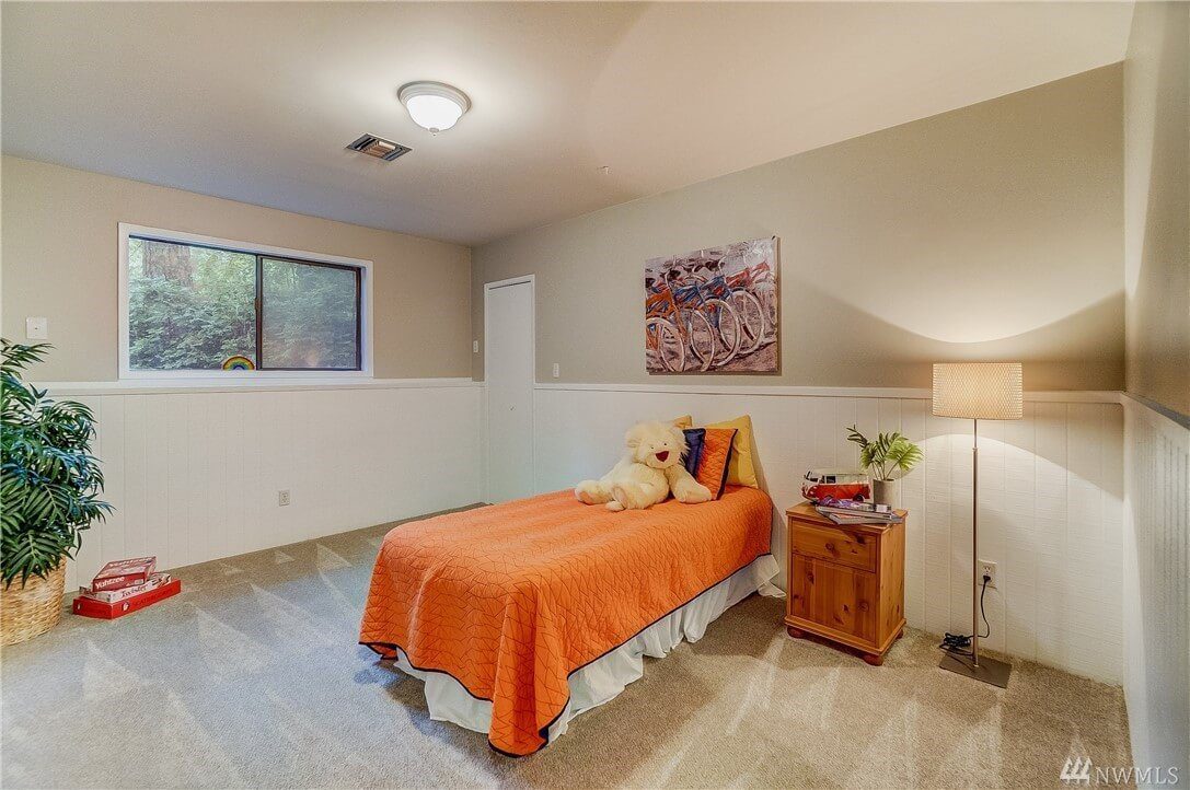 freshly painted bedroom with neutral walls and orange bedding in Cranberry Township, PA