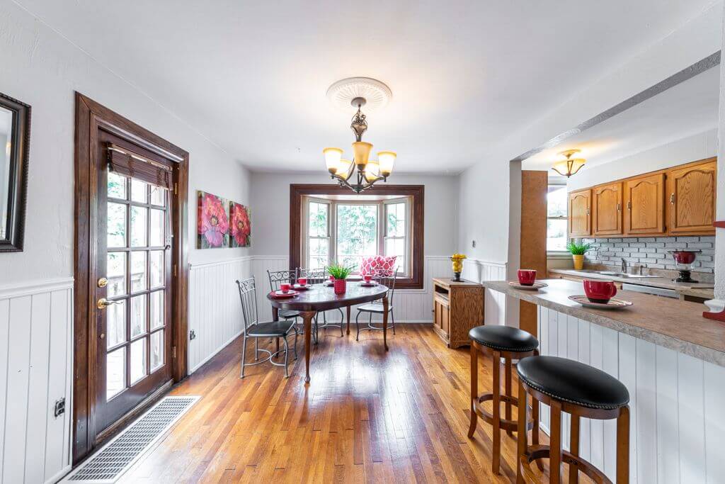 freshly painted kitchen and dining area with white wainscoting and hardwood floors in Cranberry Township, PA
