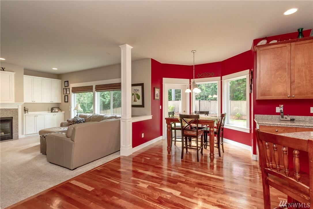 freshly painted open living and dining area with gray walls, red accent wall, and white column in Cranberry Township, PA