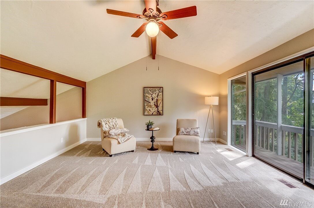 freshly painted bright living room with vaulted ceiling and sliding glass door in Cranberry Township, PA